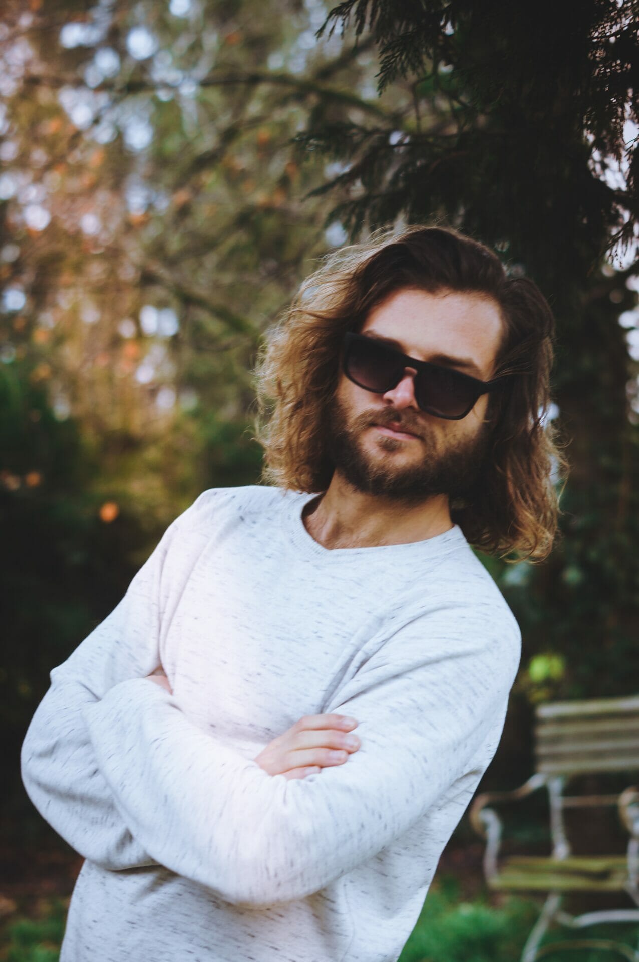 man with long hair and sunglasses
